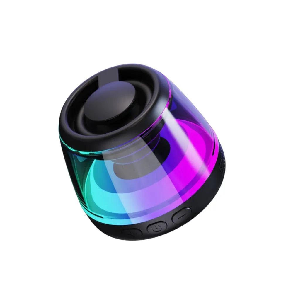 Portable white Bluetooth speaker with magnetic base, mood light, and card slot on a desk.