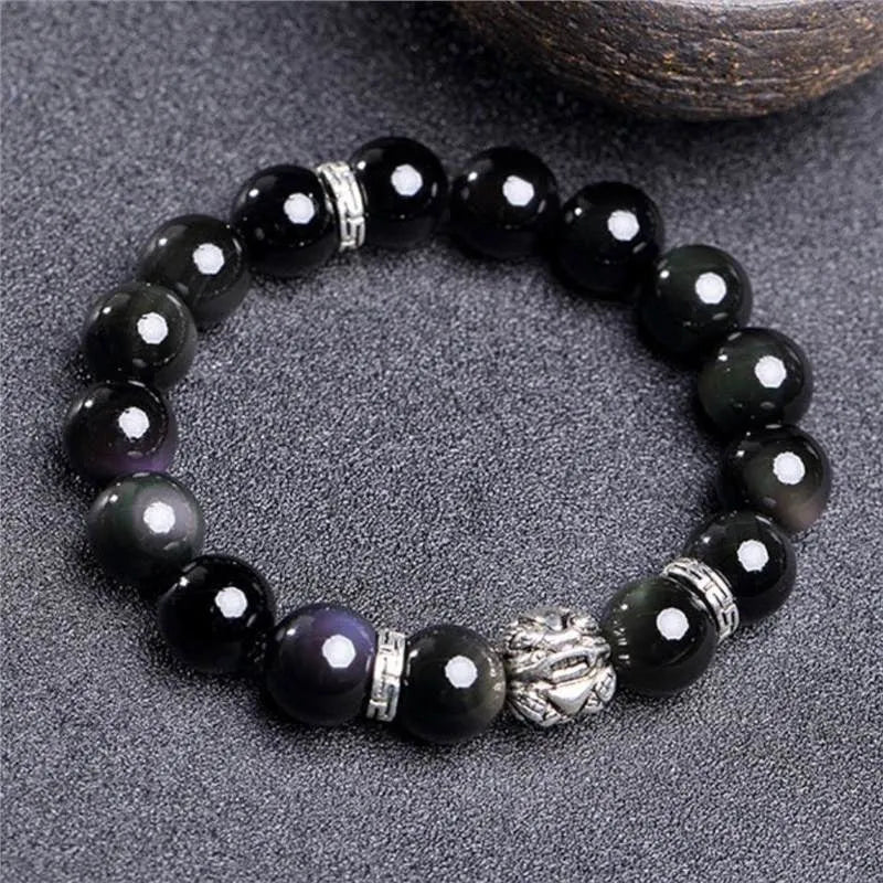 Obsidian bracelet with silver 999 settings showing natural cloud patterns in the beads