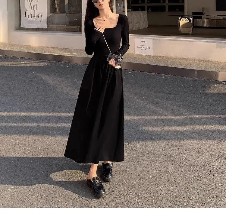Women's black square collar knitted A-line dress with long sleeves and an elastic waist.