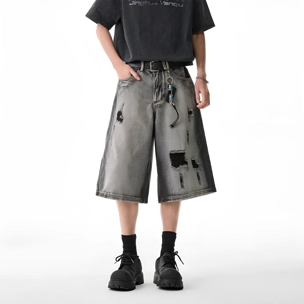 Gray water washed hole detail denim shorts with cropped length and loose fit