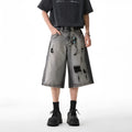 Gray water washed hole detail denim shorts with cropped length and loose fit