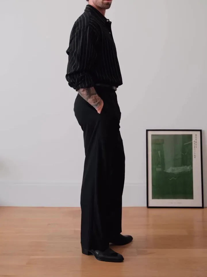 Black pinstriped button-down polyester shirt on a hanger, showing regular fit and striped pattern.