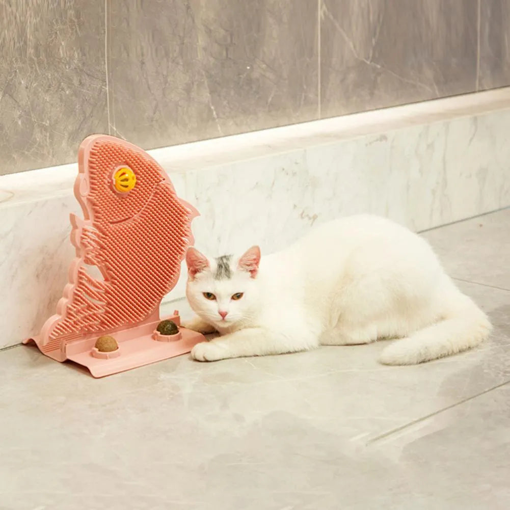 Blue fish-shaped plastic cat wall scratcher with self-grooming brush, catnip balls and mini bell