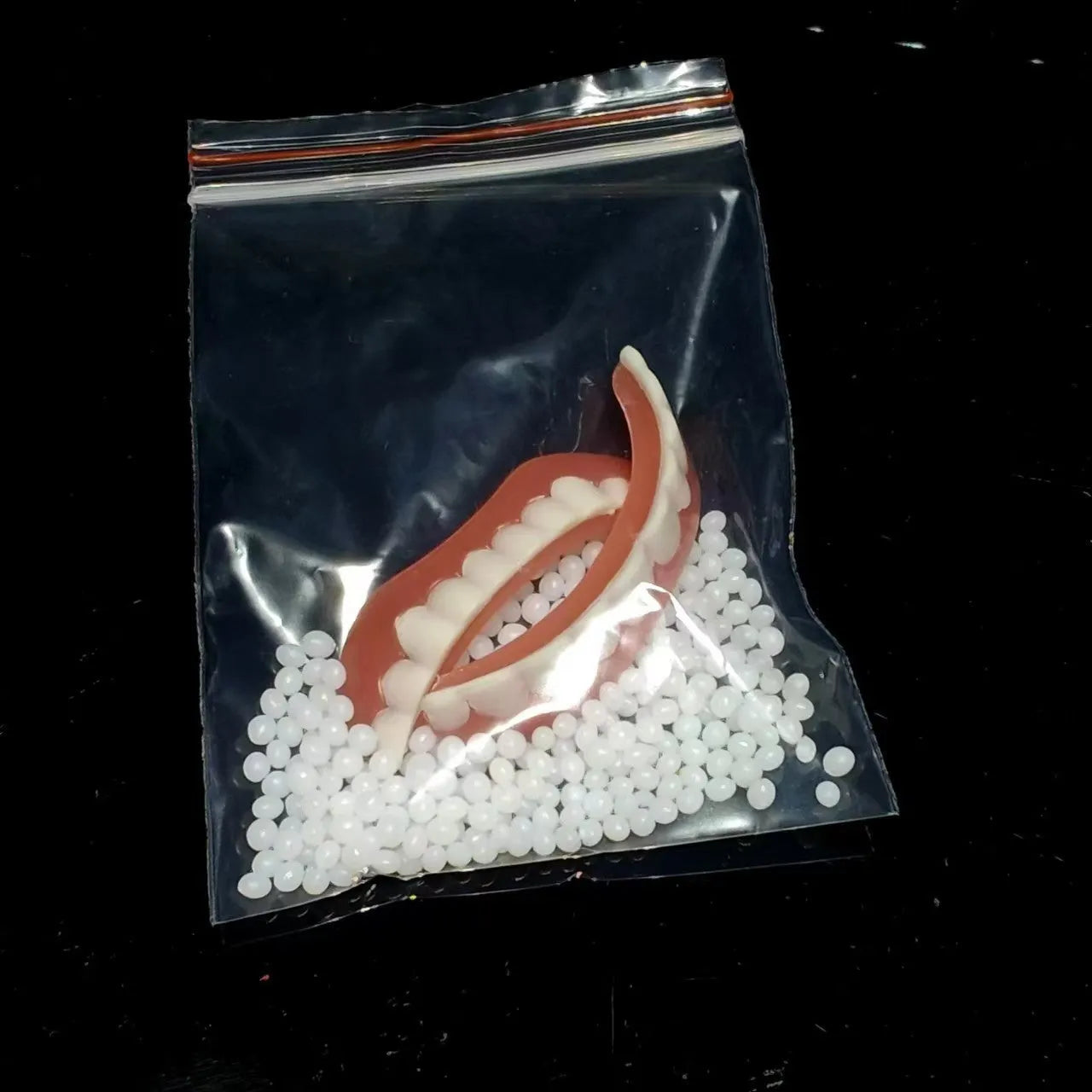 Silicone simulation dentures showing upper and lower teeth set for dental training