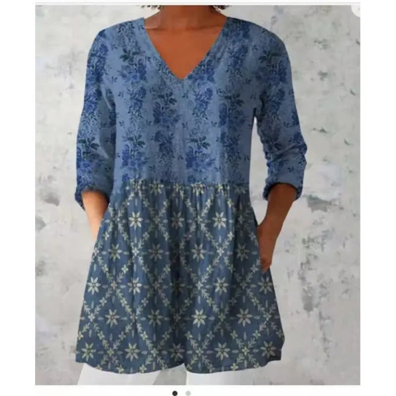 Women's loose fit printed dress with wide waist and three-quarter length sleeves.