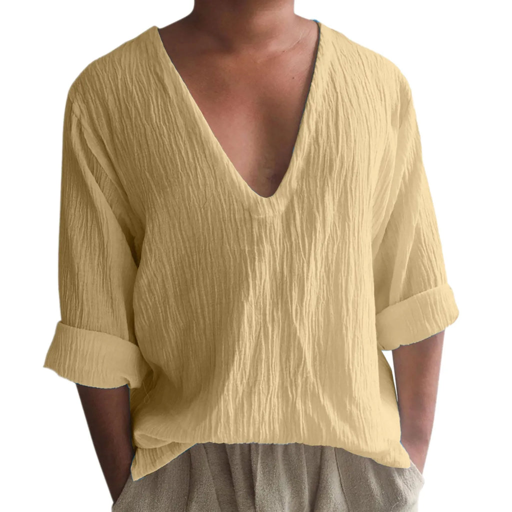 Man wearing a washed cotton long sleeve V-neck t-shirt in a solid colour.