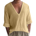Man wearing a washed cotton long sleeve V-neck t-shirt in a solid colour.