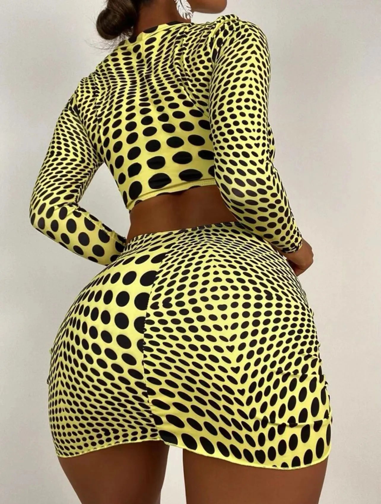 Green and yellow polka dot women's three-piece swimsuit set showing top, skirt, and bra.