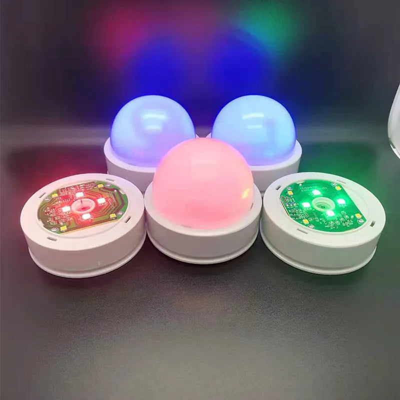 3D shooting night light with colourful gradient illumination and remote control on wooden surface