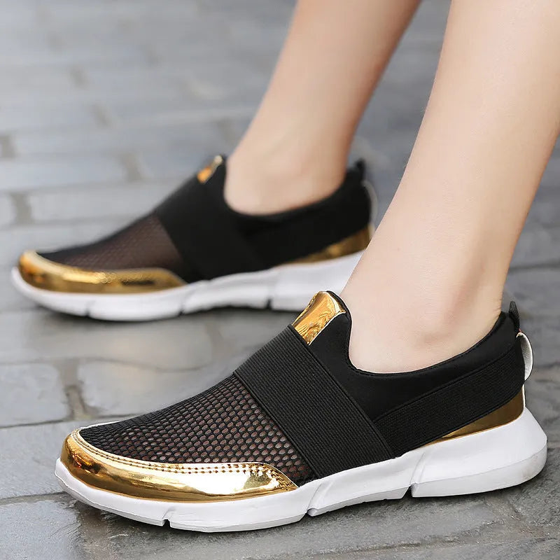 Blue, black, and grey women's lightweight sneakers with mesh lining and low-tube design.