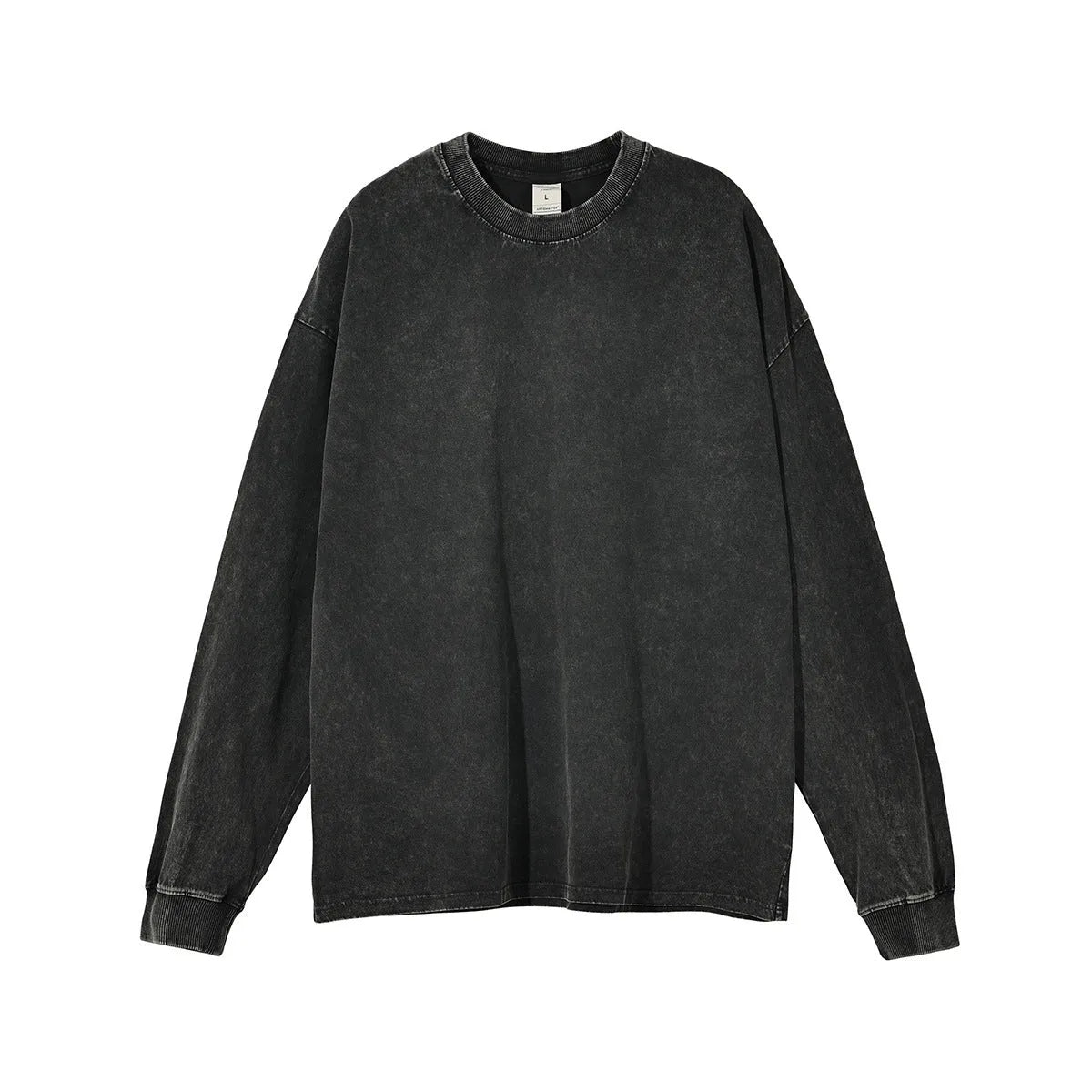 Man wearing a loose-fit batik print long sleeve cotton pullover top in a vintage washed colour.