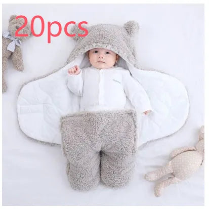 Baby quilted sleeping bag wrapper in cotton blend fabric, shown in a light blue colour.