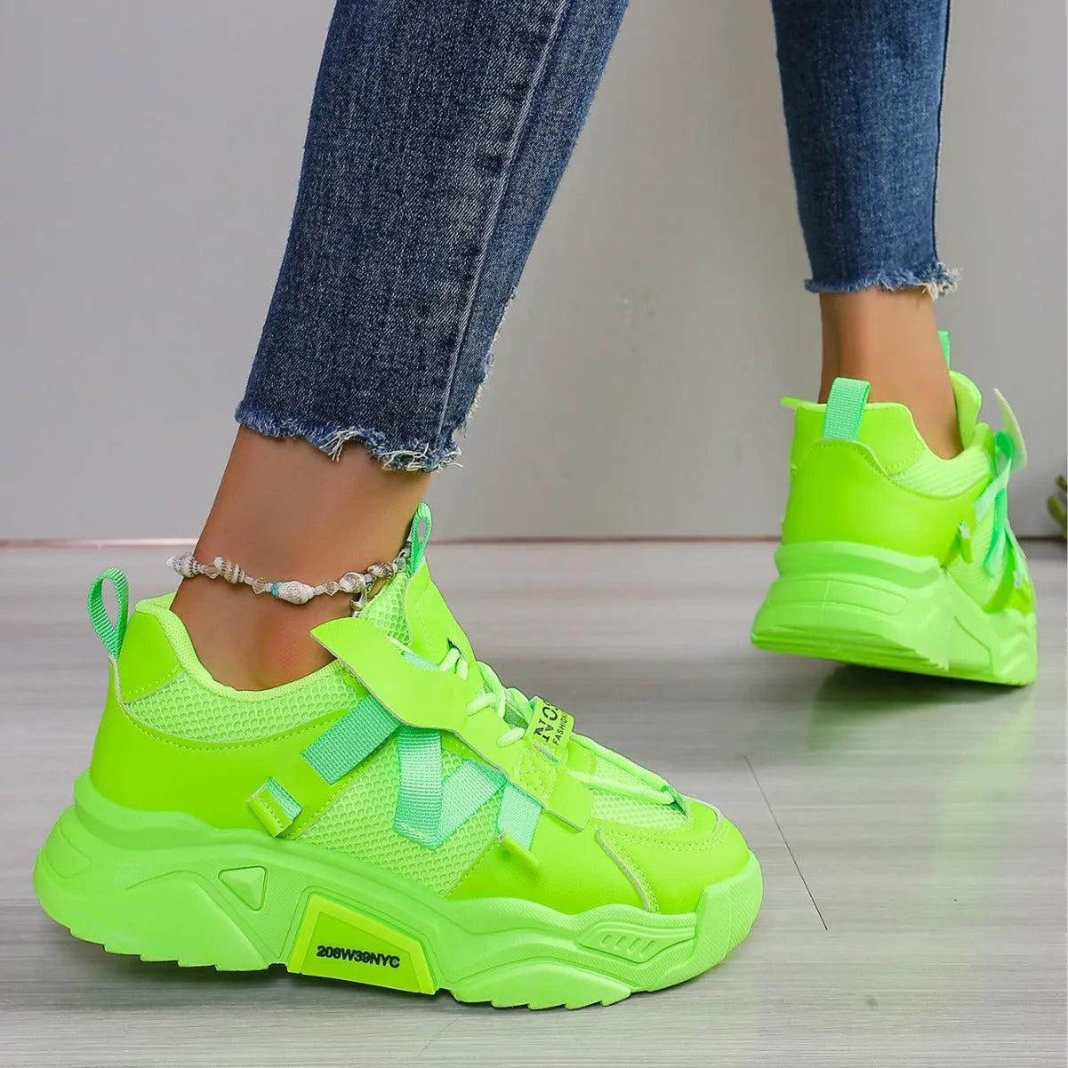 Women's green platform mesh sports shoe with lace-up front and thick sole