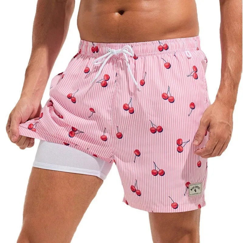 Man wearing loose green boxer-style swimming trunks made from quick-drying spandex fabric.