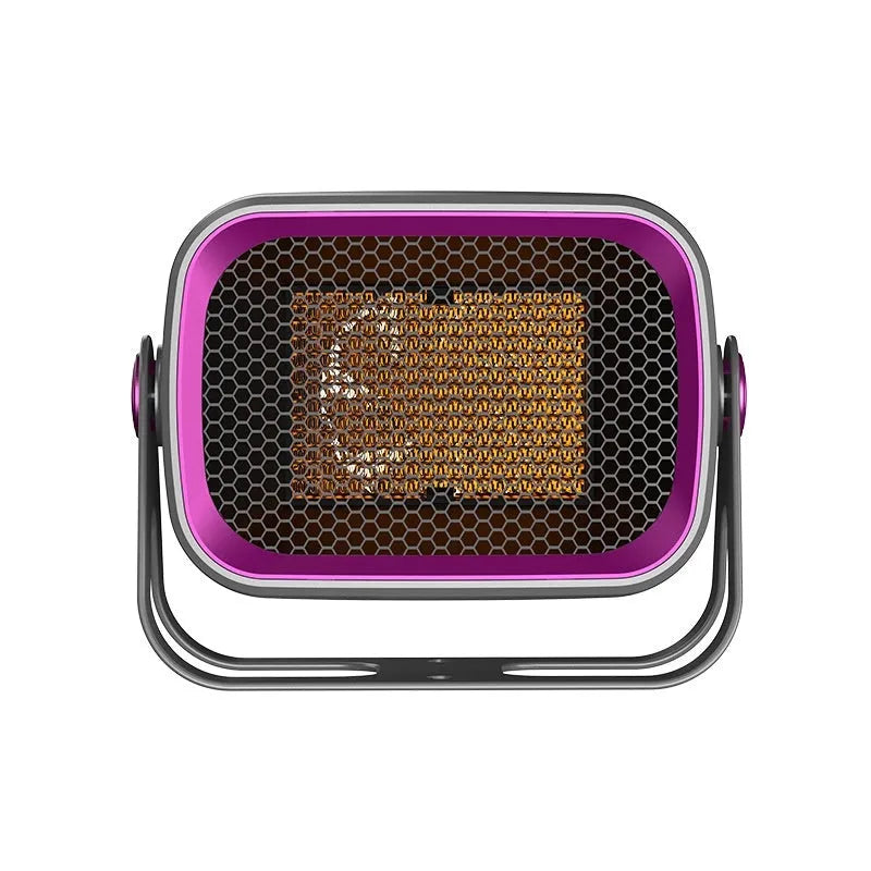 Compact white PTC ceramic desktop electric heater on a wooden desk.