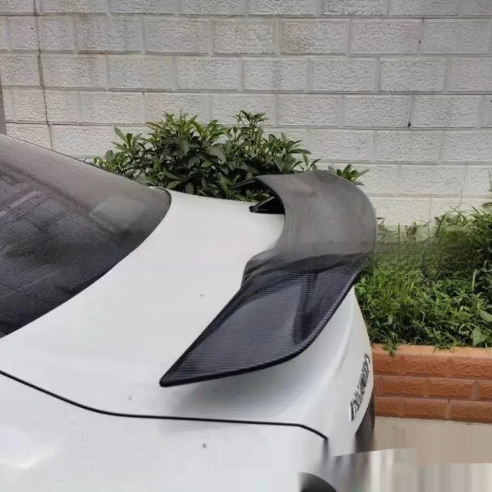 Universal punch-free car spoiler in ABS plastic shown in bright black finish.