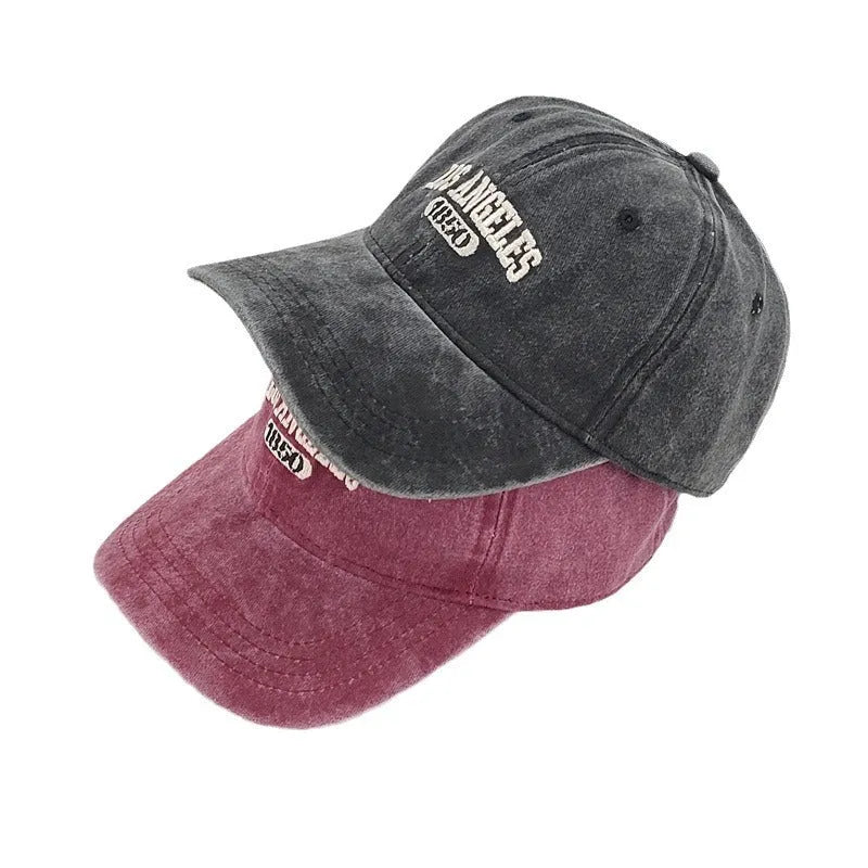 Retro distressed personalised baseball cap with embroidered letters on the front, showing adjustable strap.