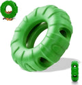 Blue natural rubber tyre-shaped dog chew toy with oval openings, for slow feeding and interactive play.