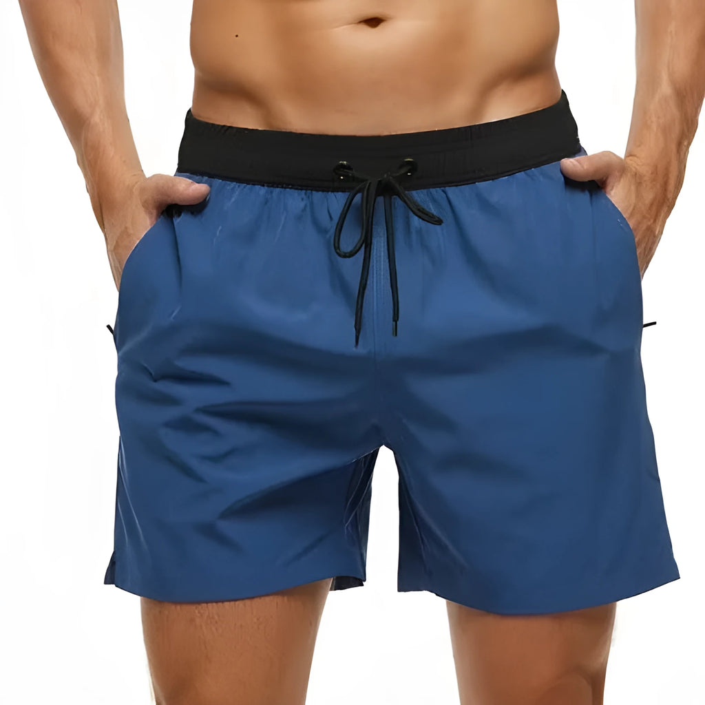 Men's blue fitness shorts with a drawstring waistband and a side zipper pocket.