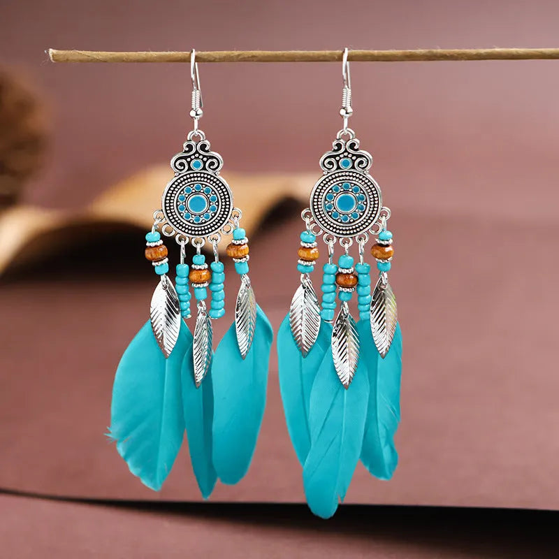 Handmade feather pattern bohemian earrings in multiple colours with leaf design detail