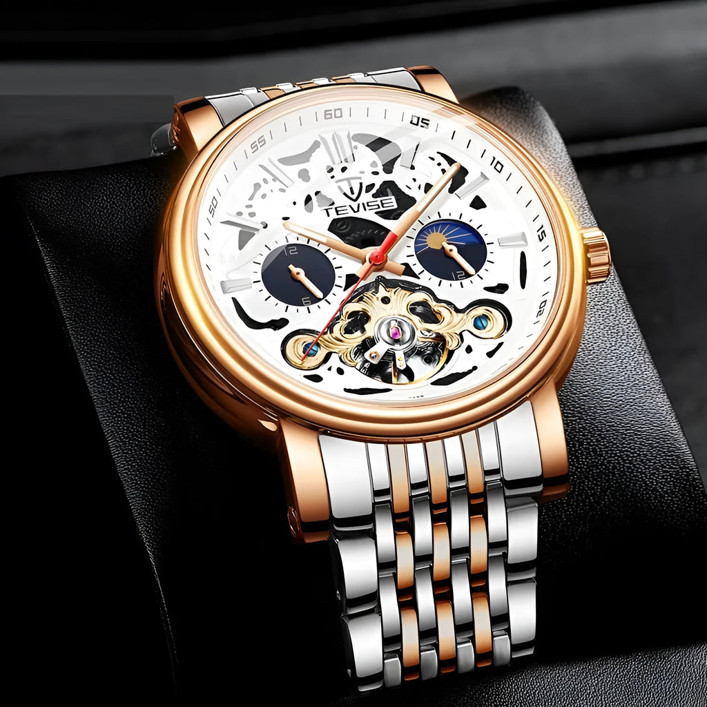 Men's tourbillon mechanical watch with luminous hands on a steel bracelet, showing a black dial.
