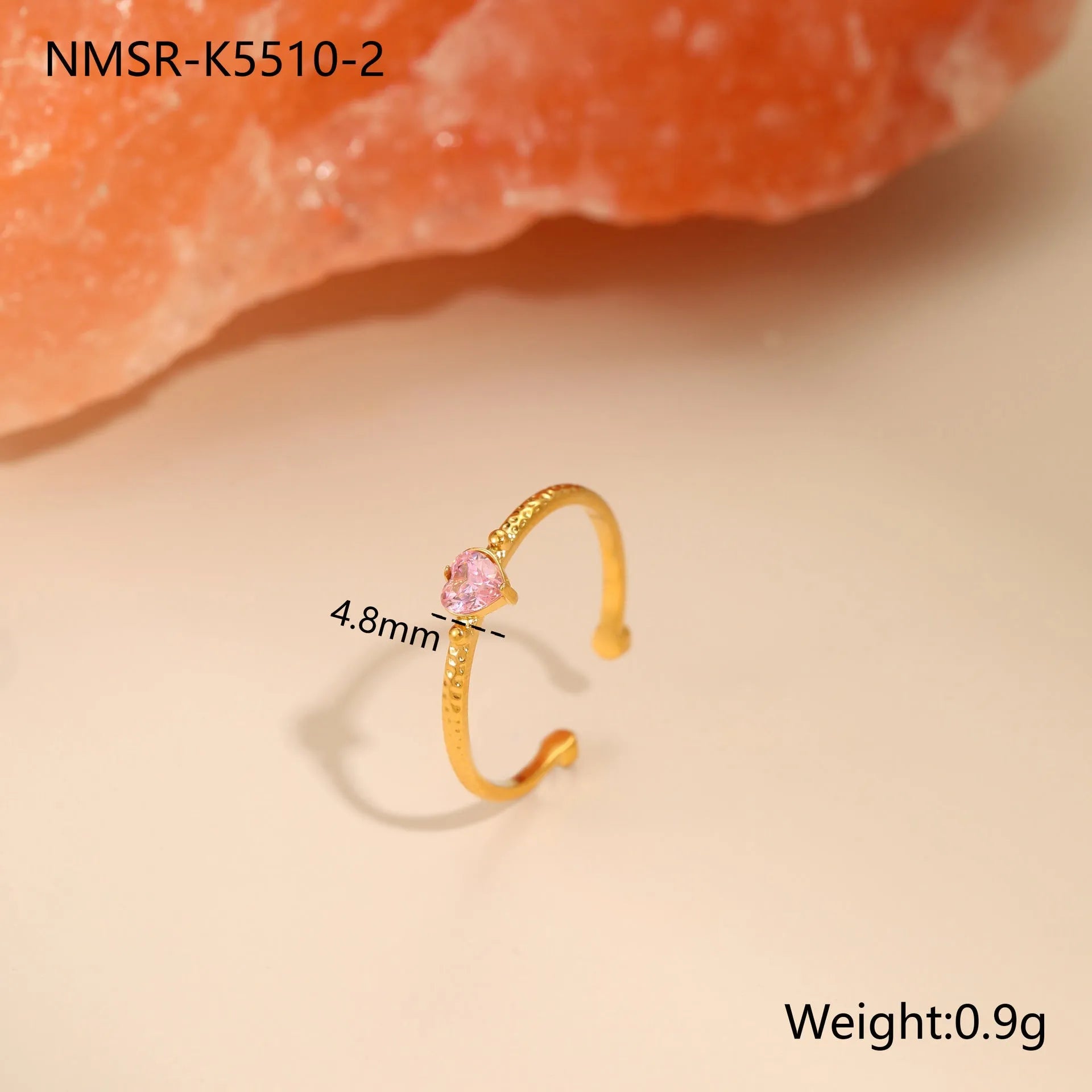 Geometric open-ended heart-shaped stainless steel ring with inlaid zircon detail in white, pink, or green.