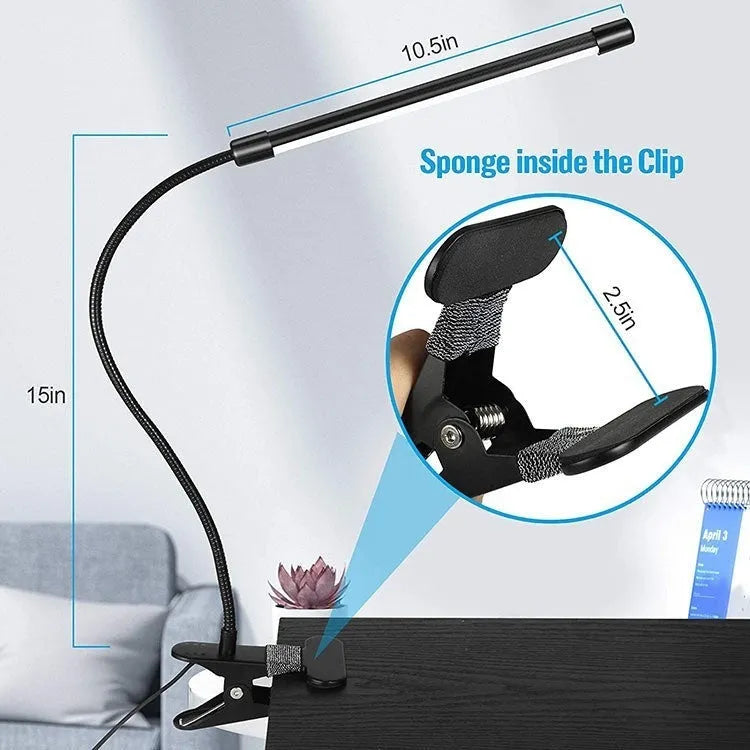 Black and white USB-powered LED desk lamp with flexible 26 cm gooseneck neck on a desk.