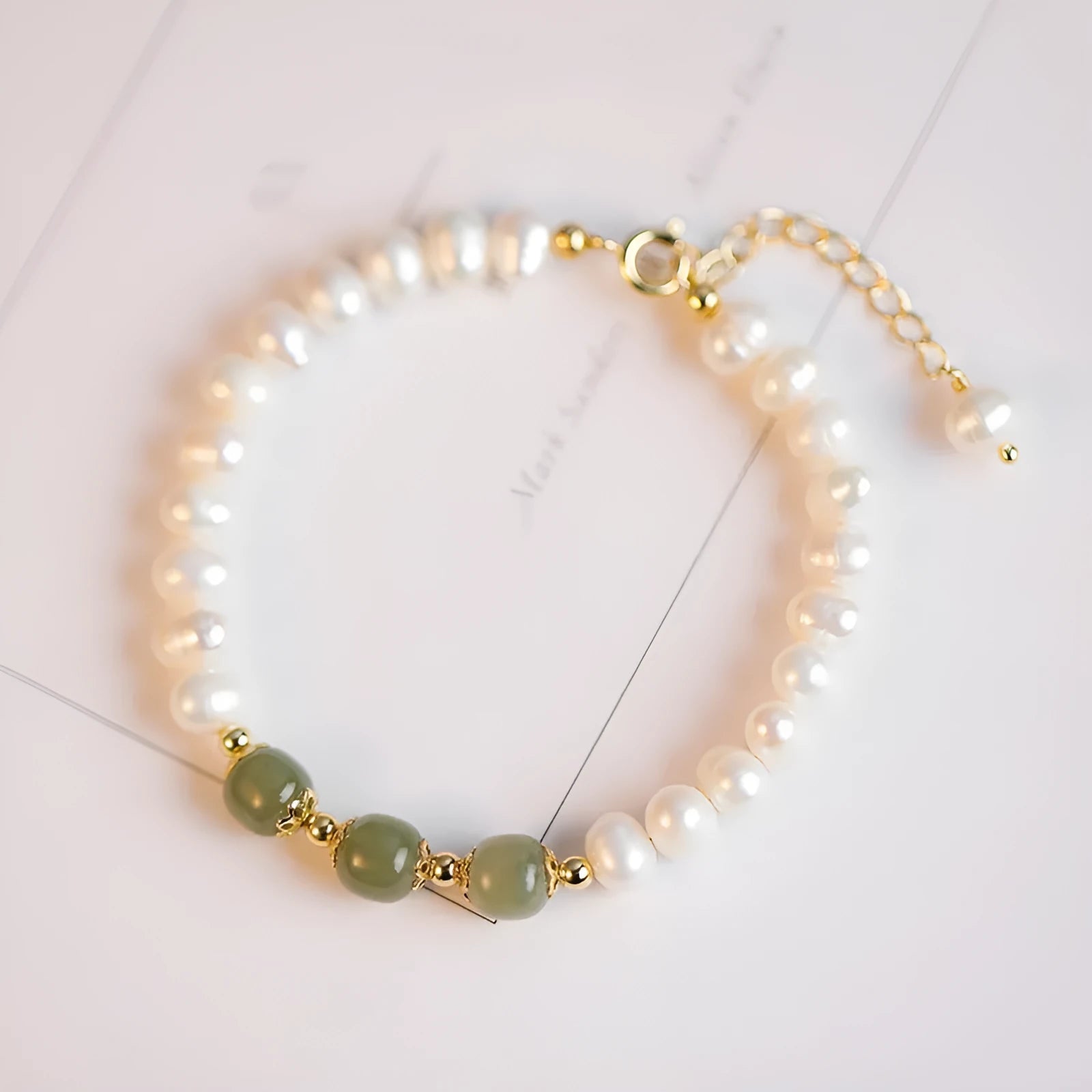 Korean style freshwater pearl bracelet with diamond-shaped beads in Hetian jade green colour.