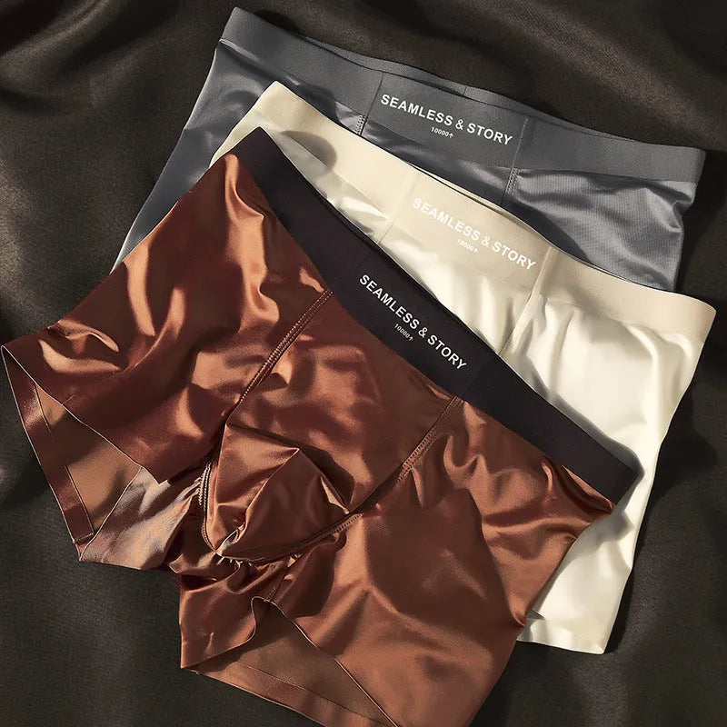 Men's ice silk underwear in multiple colours showing mid-waist design and smooth fabric texture
