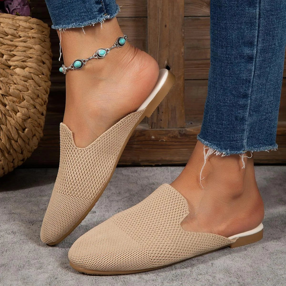 Apricot coloured mesh slip-on sandals with a round toe and flat rubber sole on a white background