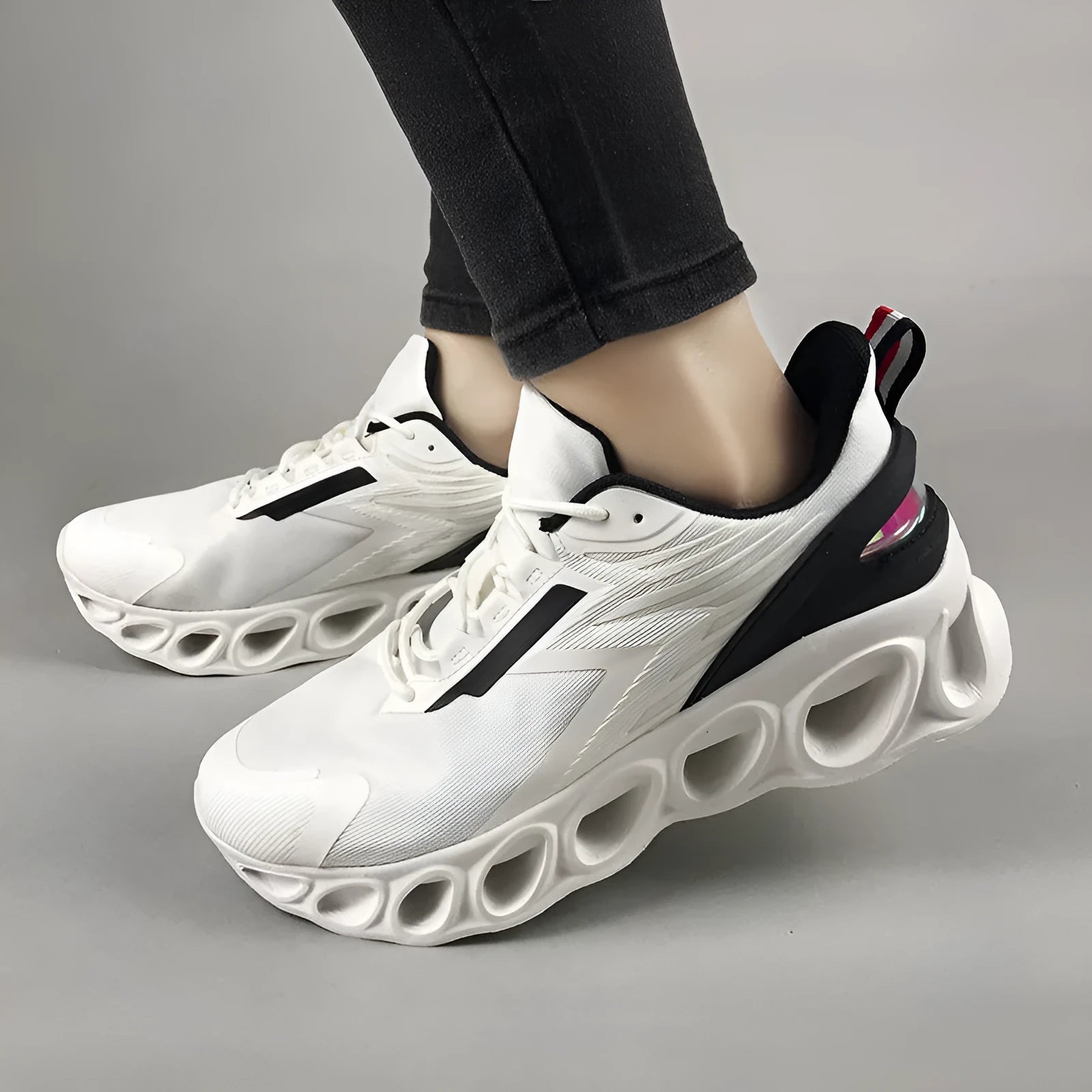 Men's low-top casual sports shoe in black with mesh upper, round toe, and lace-up front.