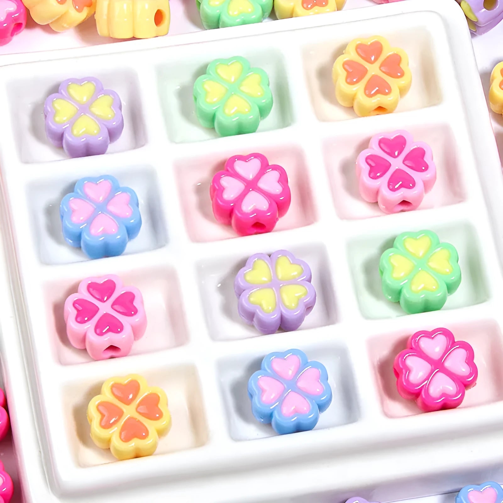 15mm acrylic clover craft beads with frosted finish in multiple colours including pink, blue, yellow, and green