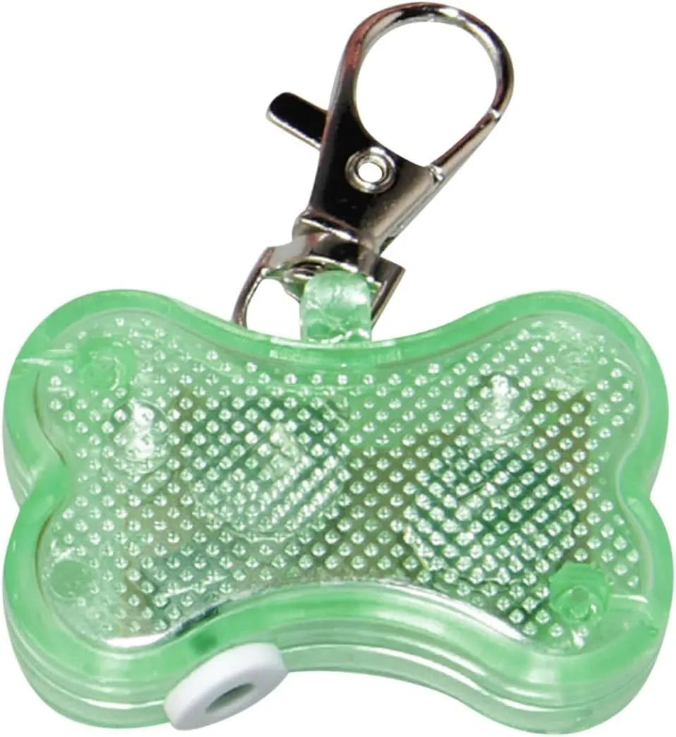 Blue LED luminous bone-shaped pendant for pet collars showing scale next to LR44 batteries.