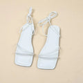 Women's flat sandals with ankle ring bandage cloth design and front lace-up in white colour