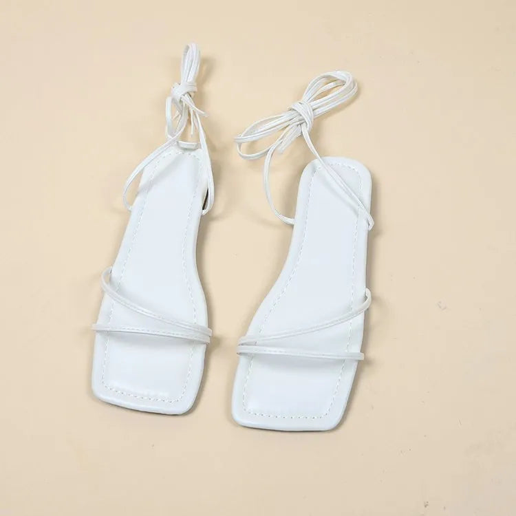 Women's flat sandals with ankle ring bandage cloth design and front lace-up in white colour