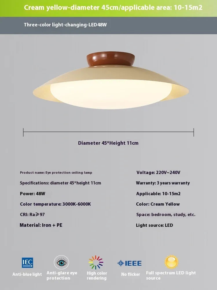 Modern cream style flying saucer shaped ceiling lamp in an iron shade.