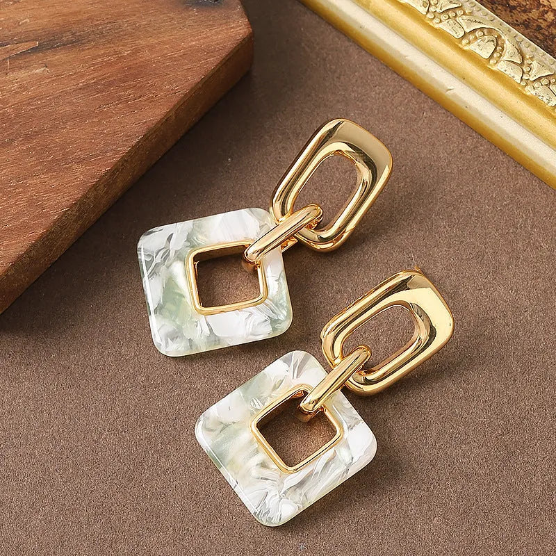 Hollow geometric square earrings with chamfered corners in electroplated copper