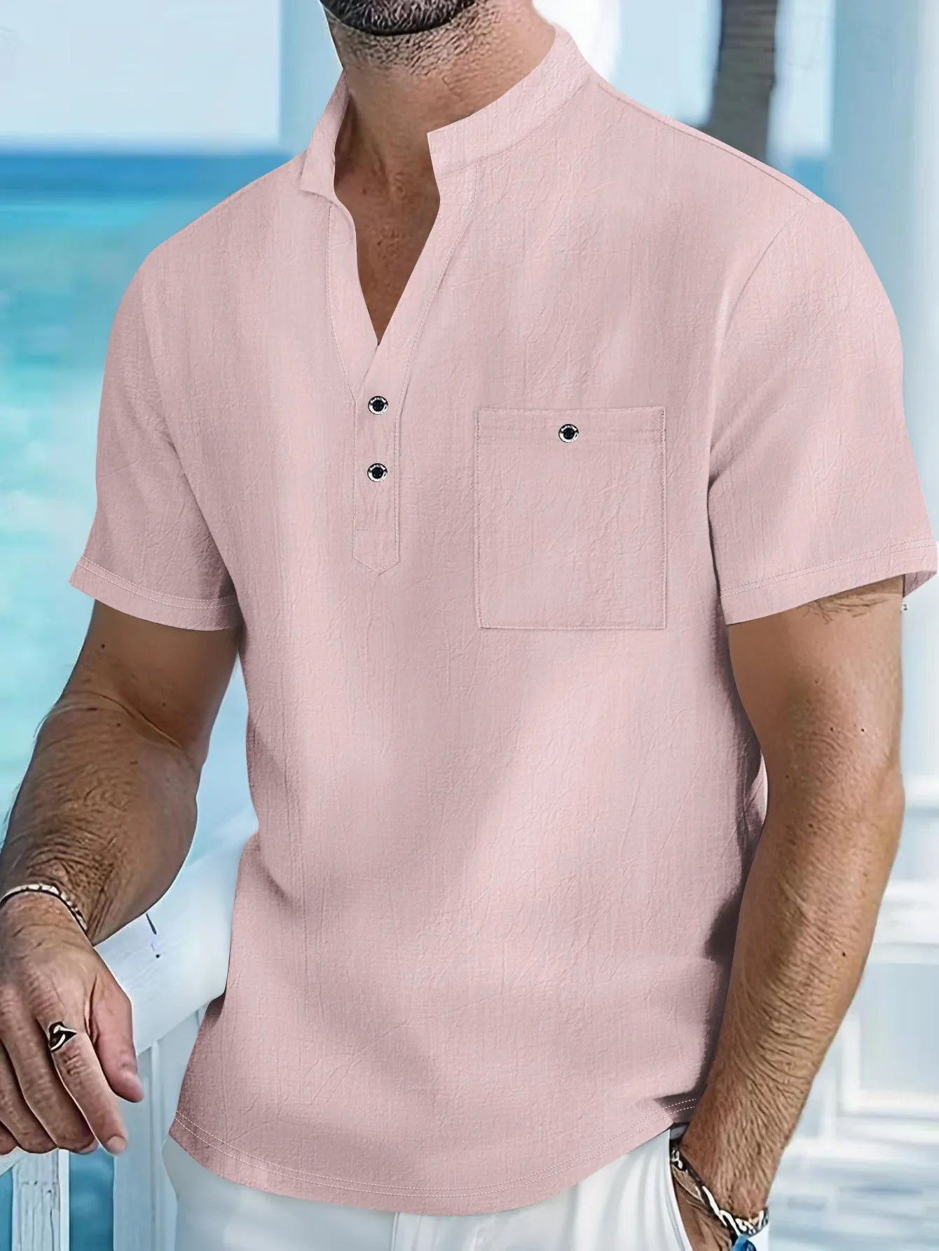 Men's apricot-coloured linen blend T-shirt with a stand collar and short sleeves on a hanger.