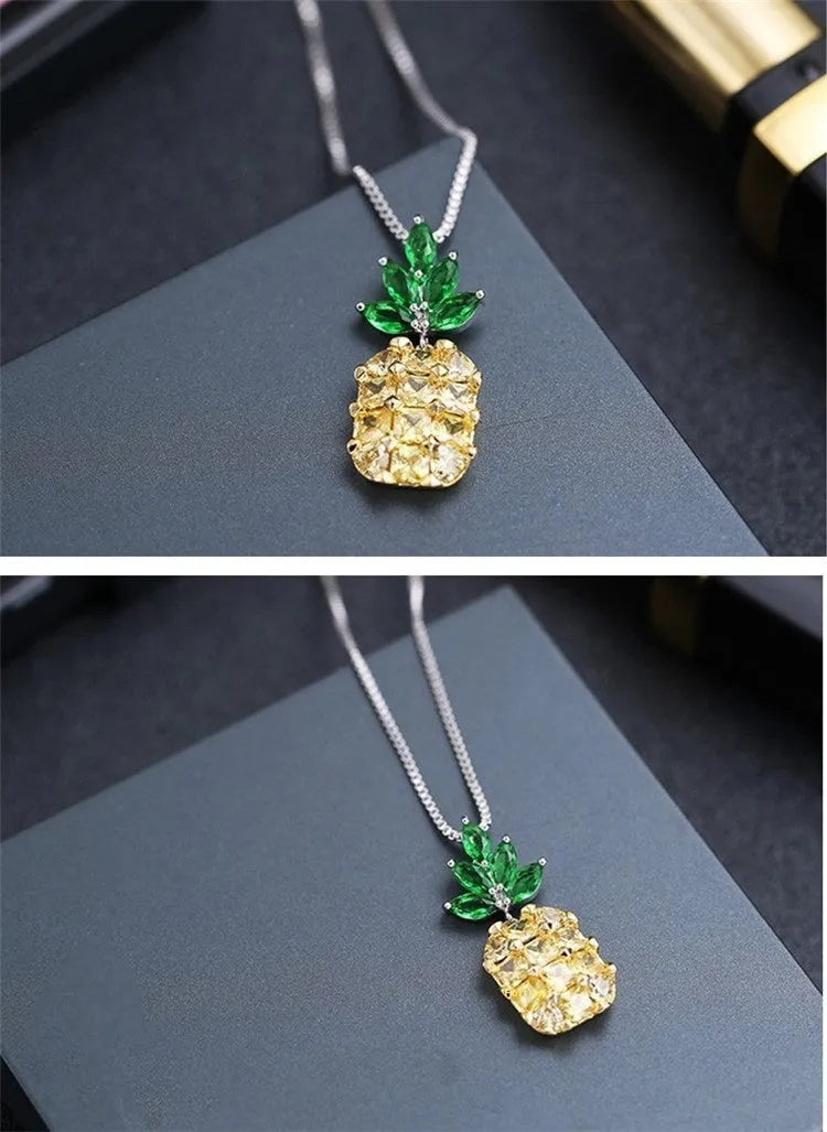 Silver geometric women's necklace with a pineapple and diamond motif pendant.