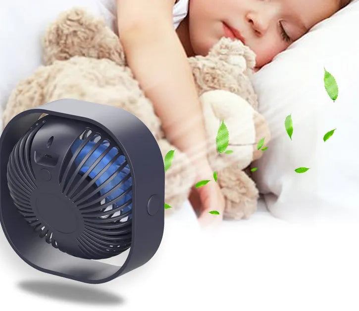 USB charging desk fan with alarm clock in blue, showing 360-degree rotation.
