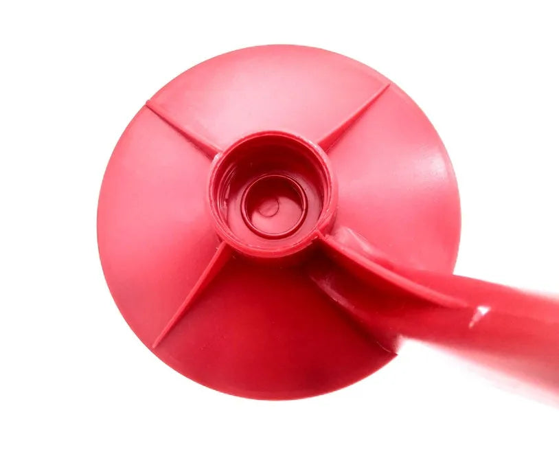 Red plastic Magic Tap soda dispenser attached to an inverted 2-litre bottle