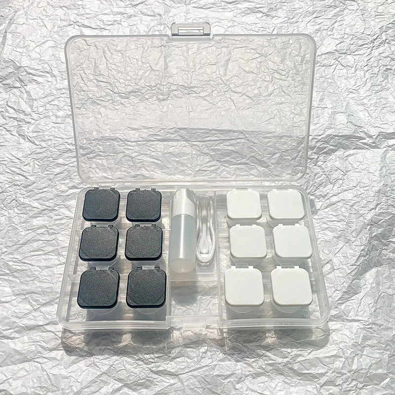 Rectangular contact lens case in various colour combinations including black white and pink white