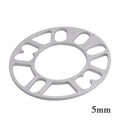 Set of metal hubcentric wheel spacer gaskets in different thicknesses for car brake caliper clearance.