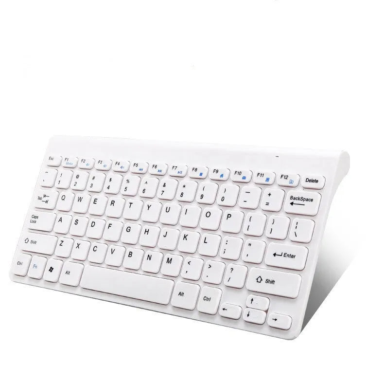 Black wireless keyboard and mouse set with USB receiver on wooden desk