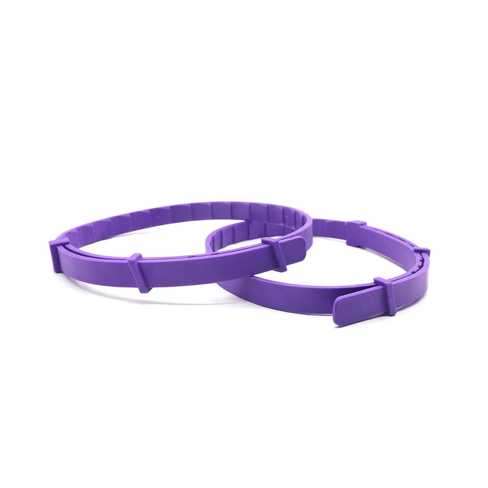 Set of four monochrome dog anxiety relief collars in assorted colours, showing soft TPR material and adjustable 62cm length.