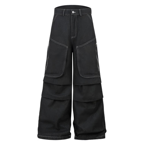 Black pleated workwear jeans with multiple pockets showing mid-waist fit and zip placket opening
