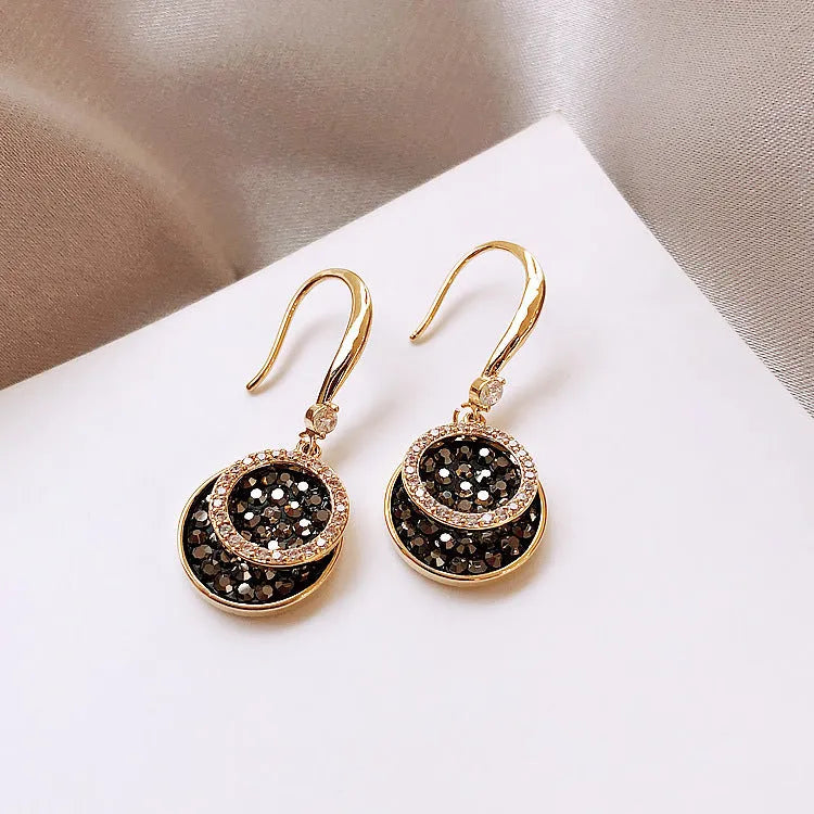 Black geometric round alloy drop earrings with 3.6cm length on a white background.