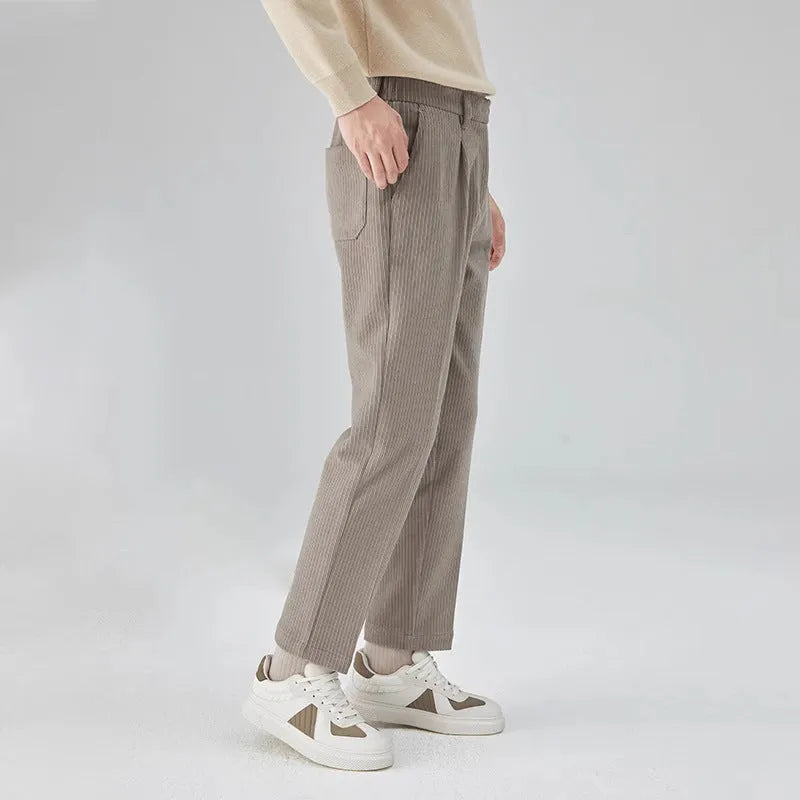Men's straight-leg corduroy trousers in a loose fit, shown in beige colour.