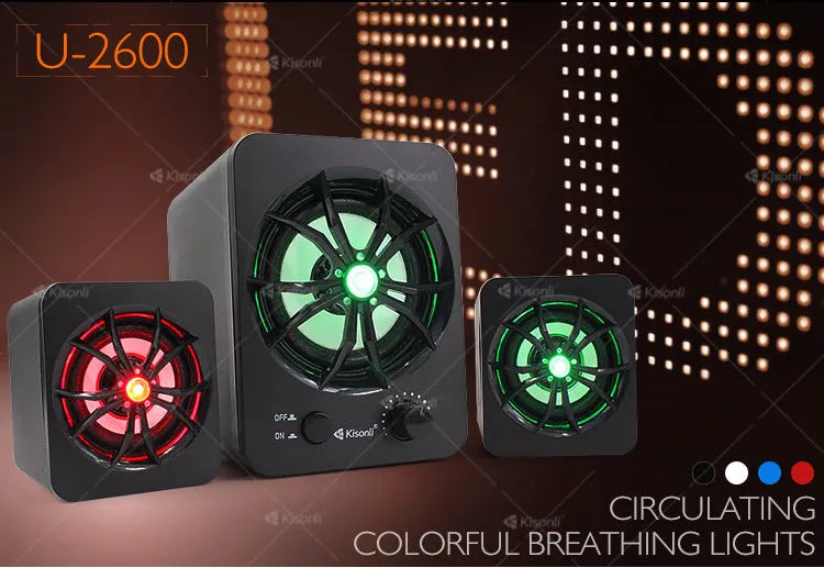 Green U-2600 mini 2.1 USB computer speaker with glowing colourful lights on a desk.