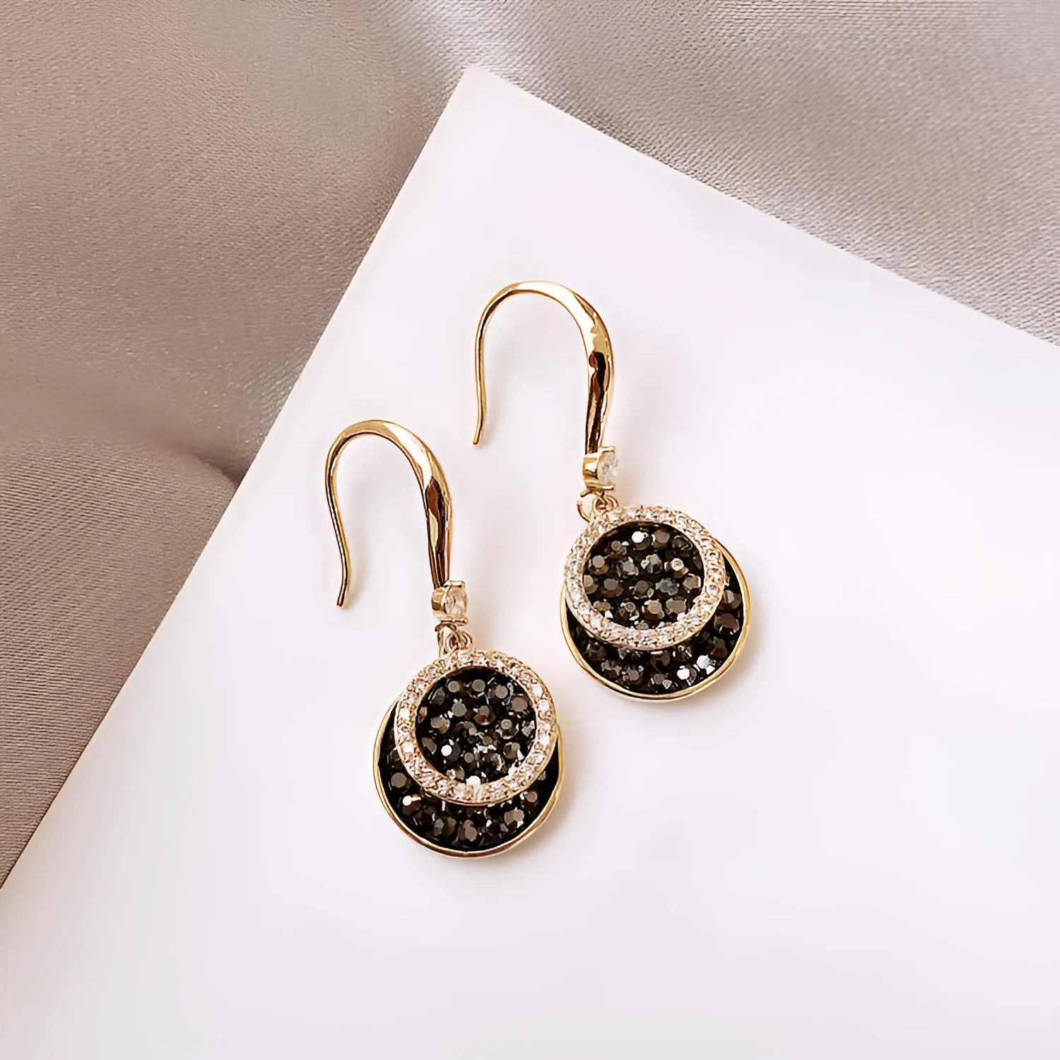 Black geometric round alloy drop earrings with 3.6cm length on a white background.